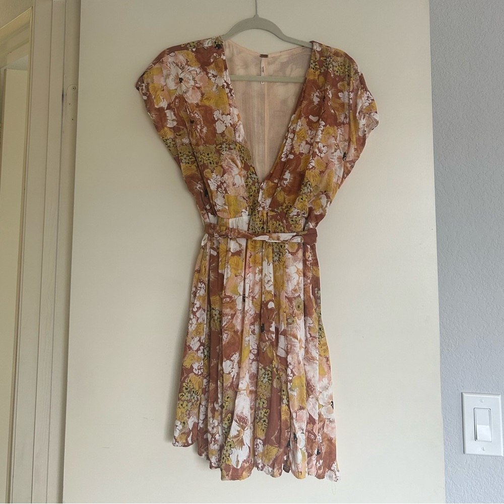 Free People A line silhouette, short sleeve, v neck mini dress.